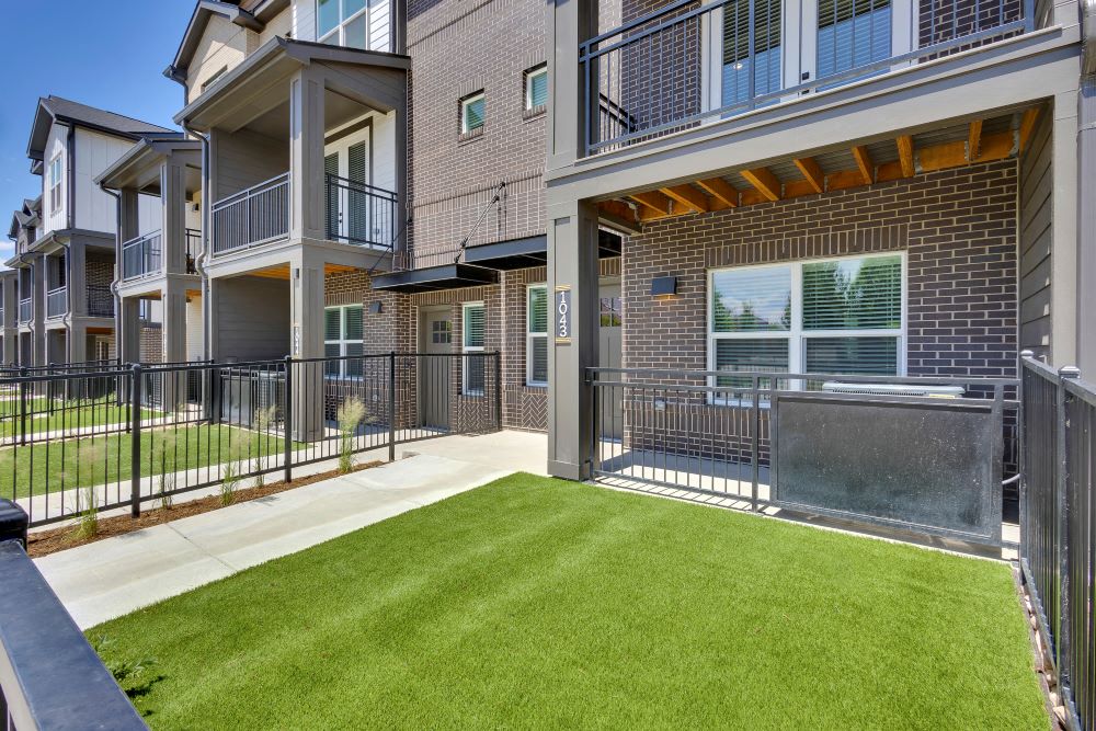 Private fenced front yard of townhome